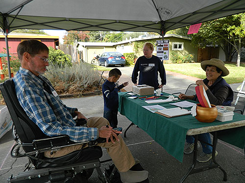 checking in at the street mural volunteer booth